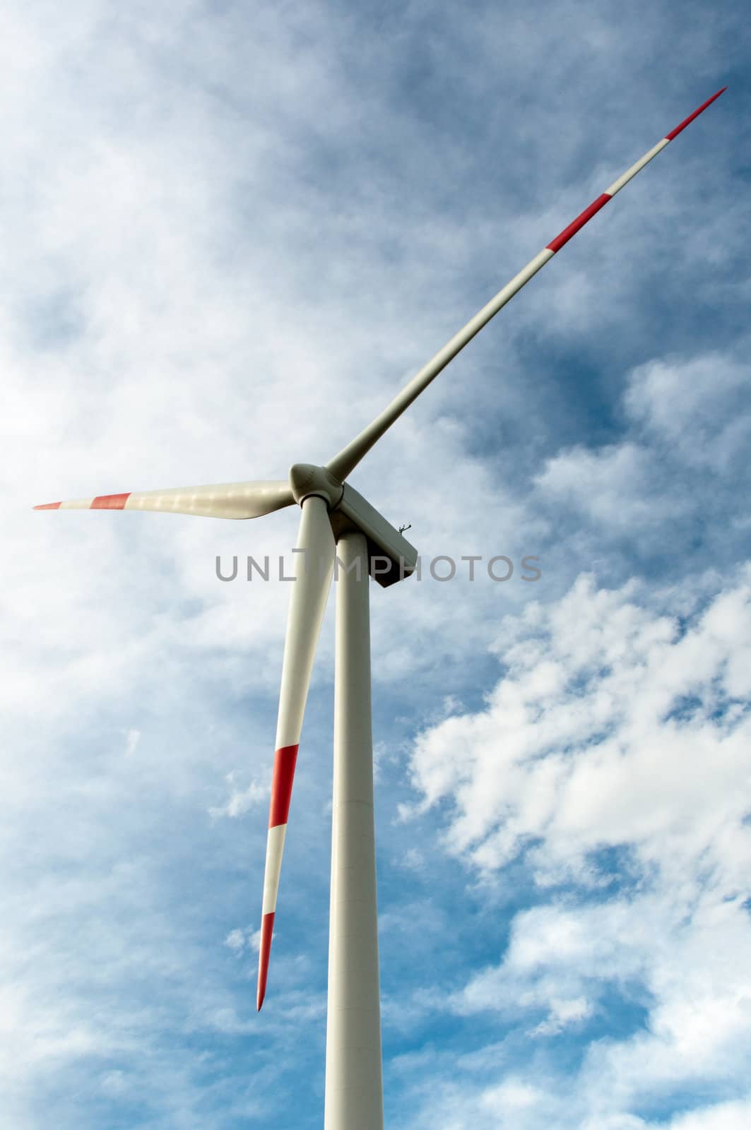 close-up portrait of wind turbine in blue sky