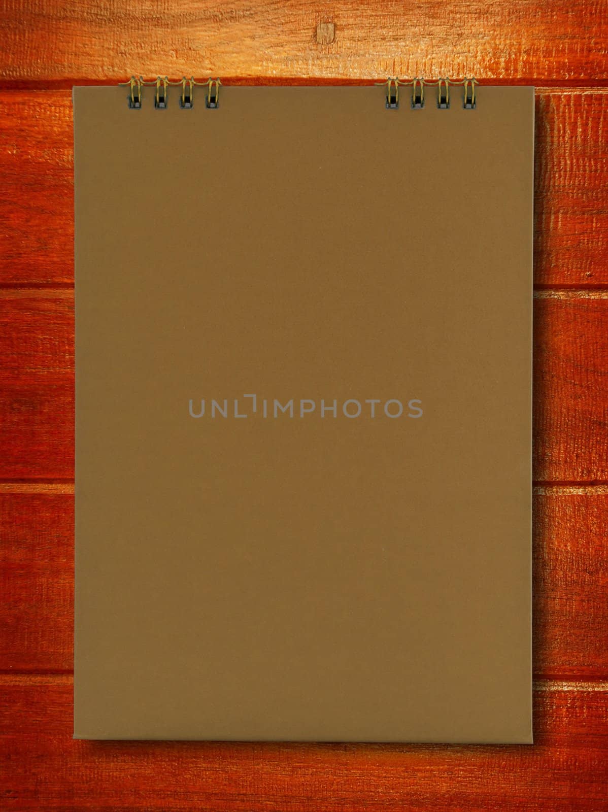 brown notebook on wood background