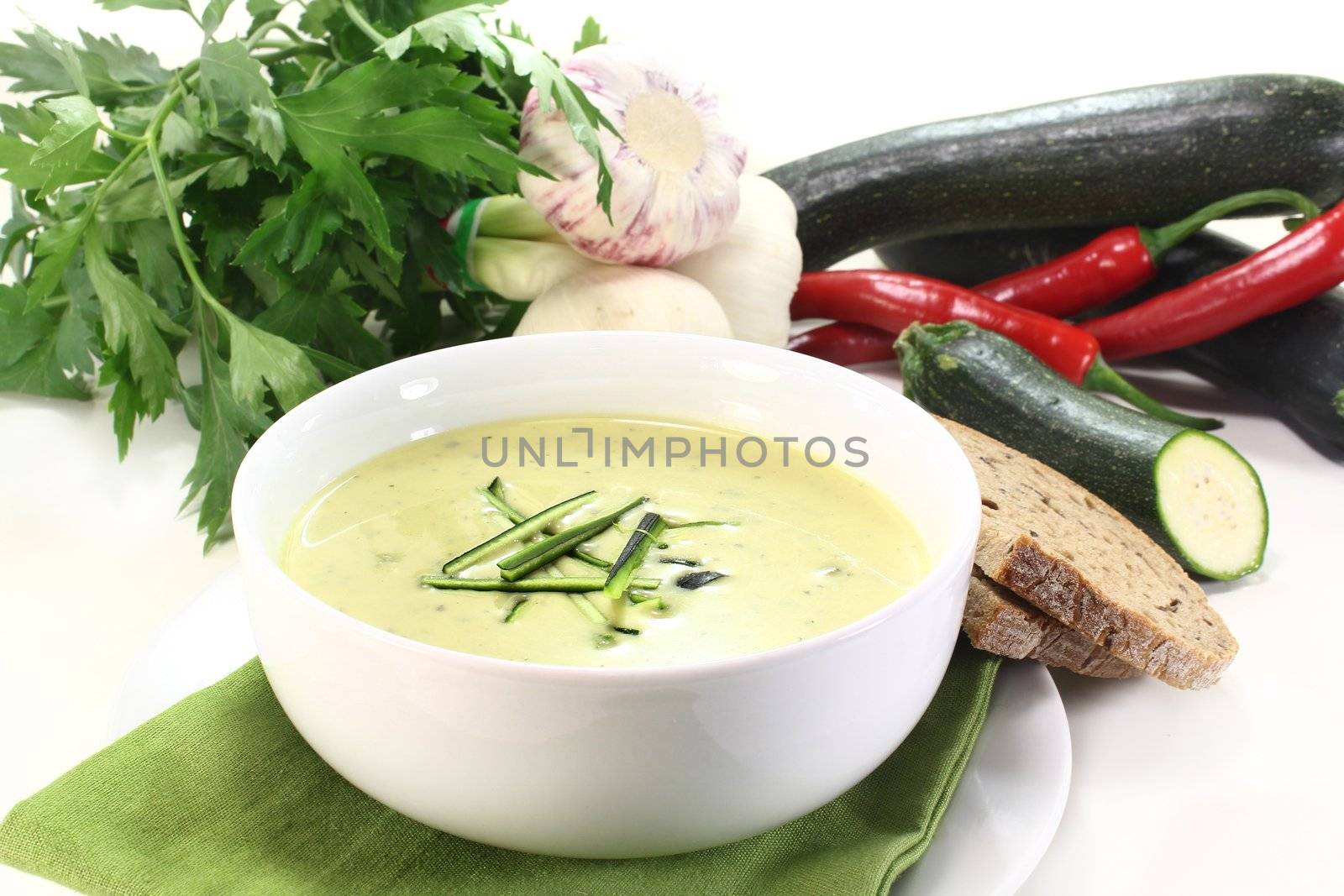 a bowl of zucchini creme soup with fresh julienne