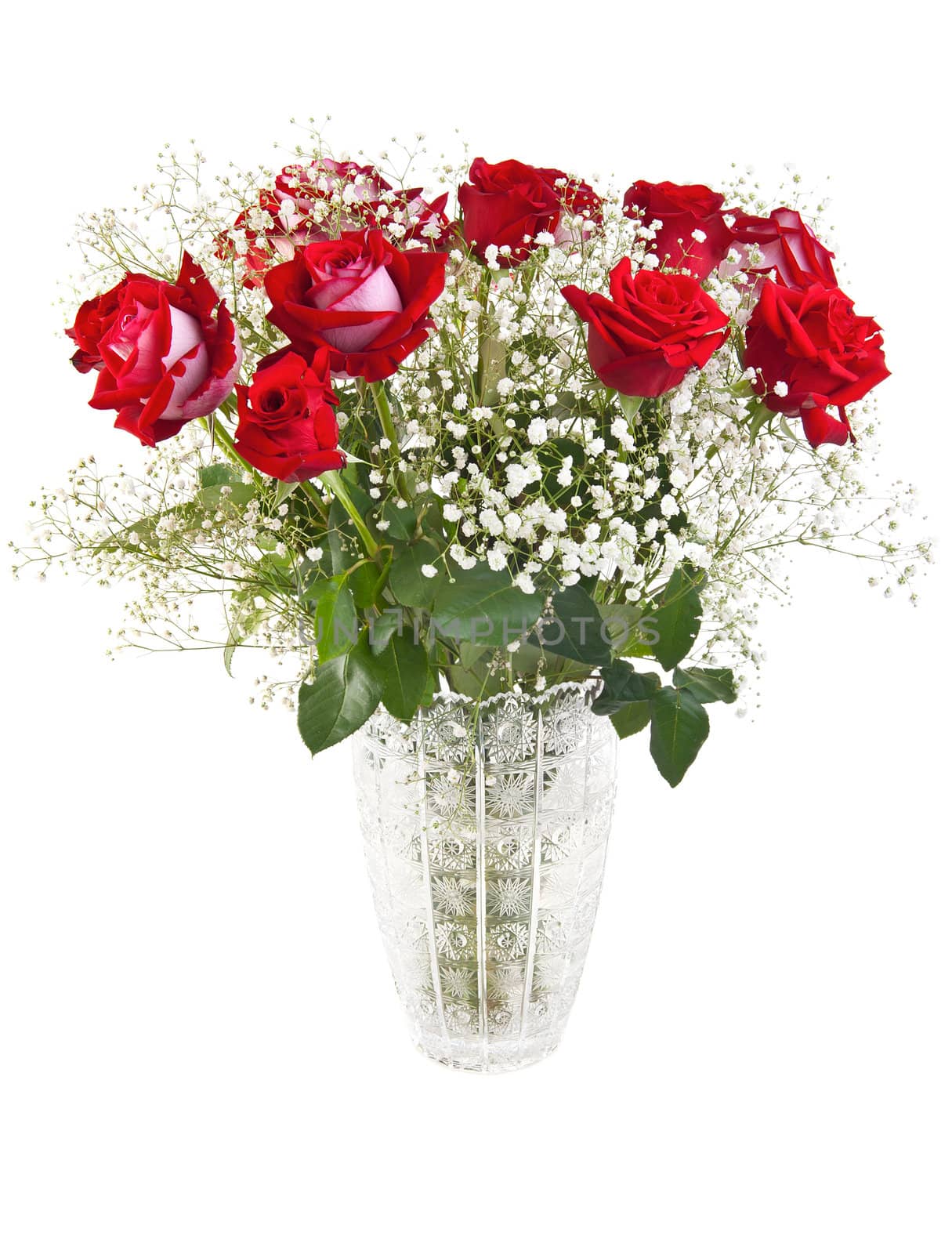Beautiful red roses bouquet in a crystal vase isolated on white