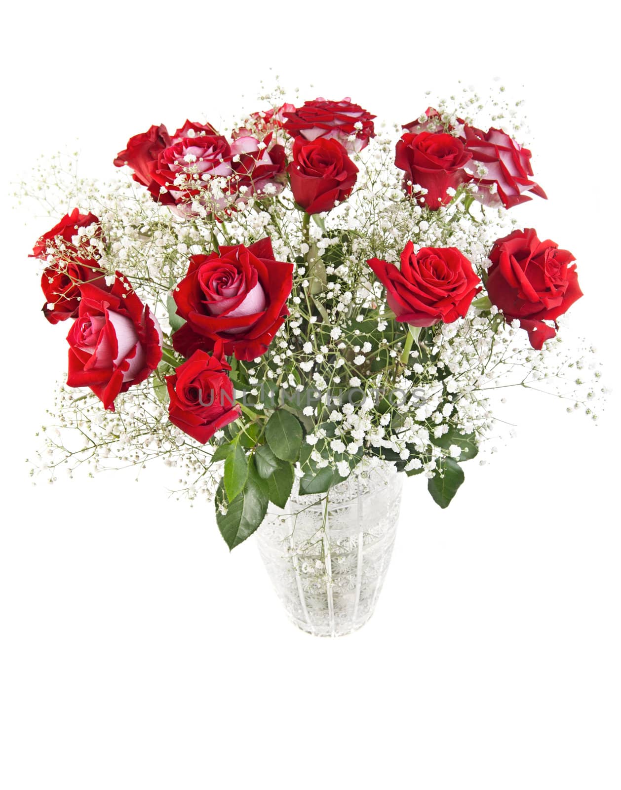 Beautiful red roses bouquet in a crystal vase isolated on white