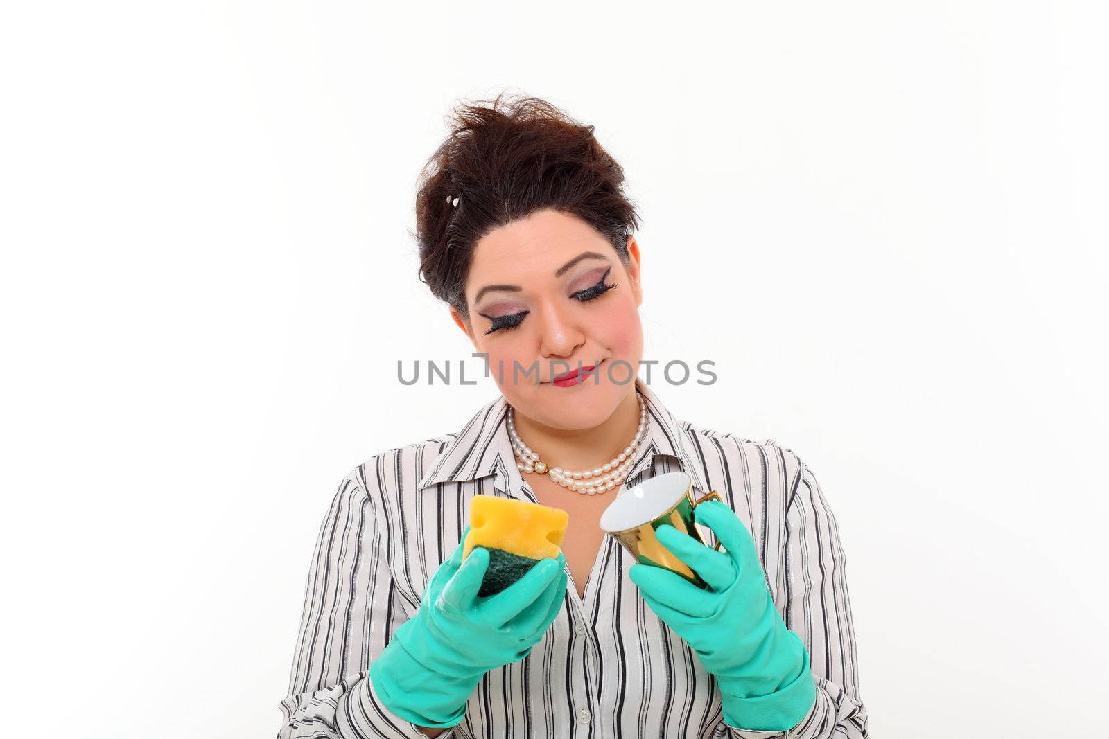 Woman in carrier cleaning a gold mug