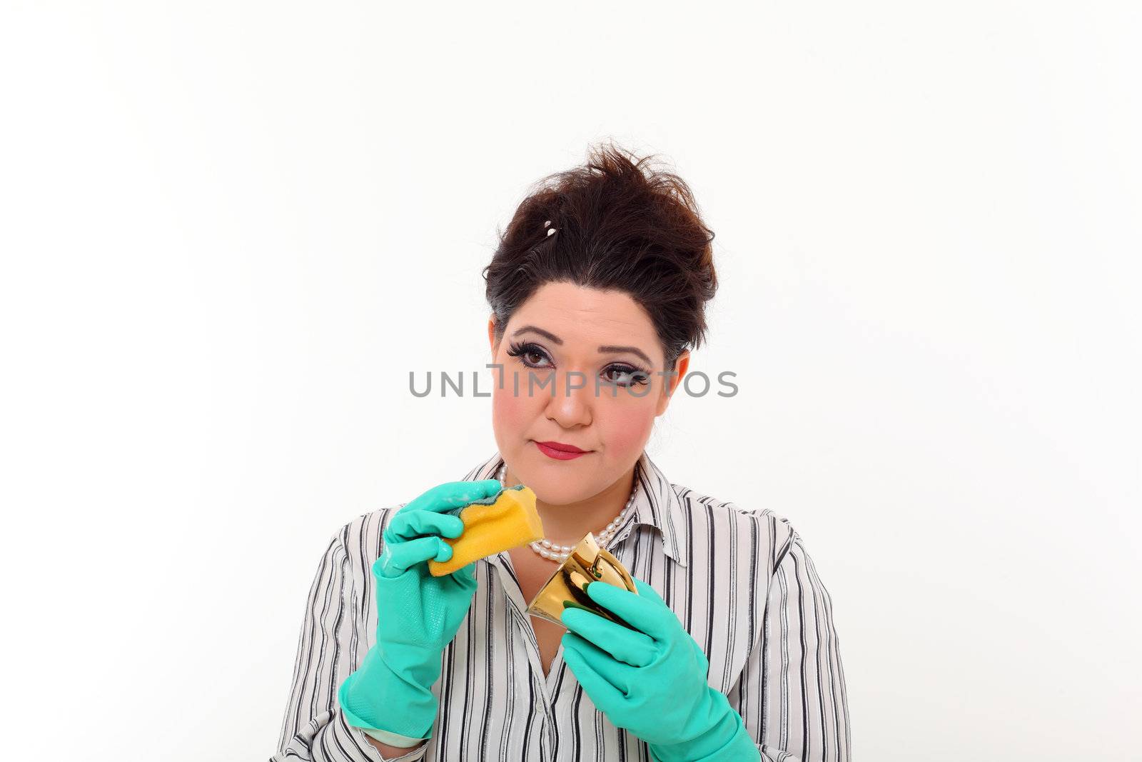 Woman in carrier cleaning a gold mug