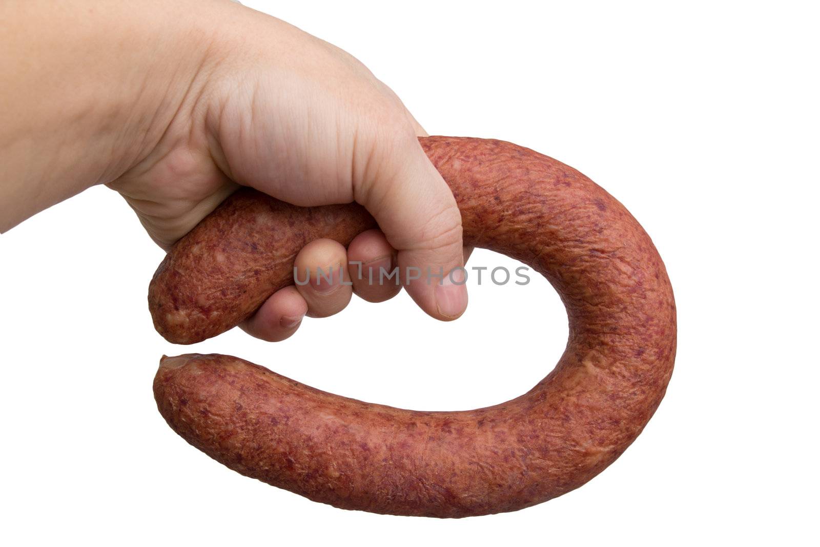 sausage in his hand on a white background
