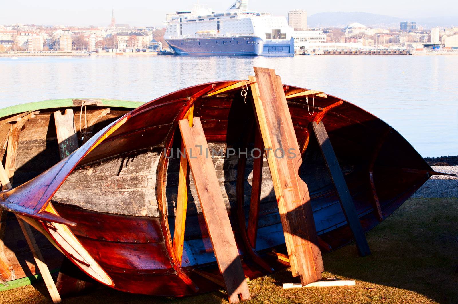 Wooden boat restoration cruiser on background by Nanisimova