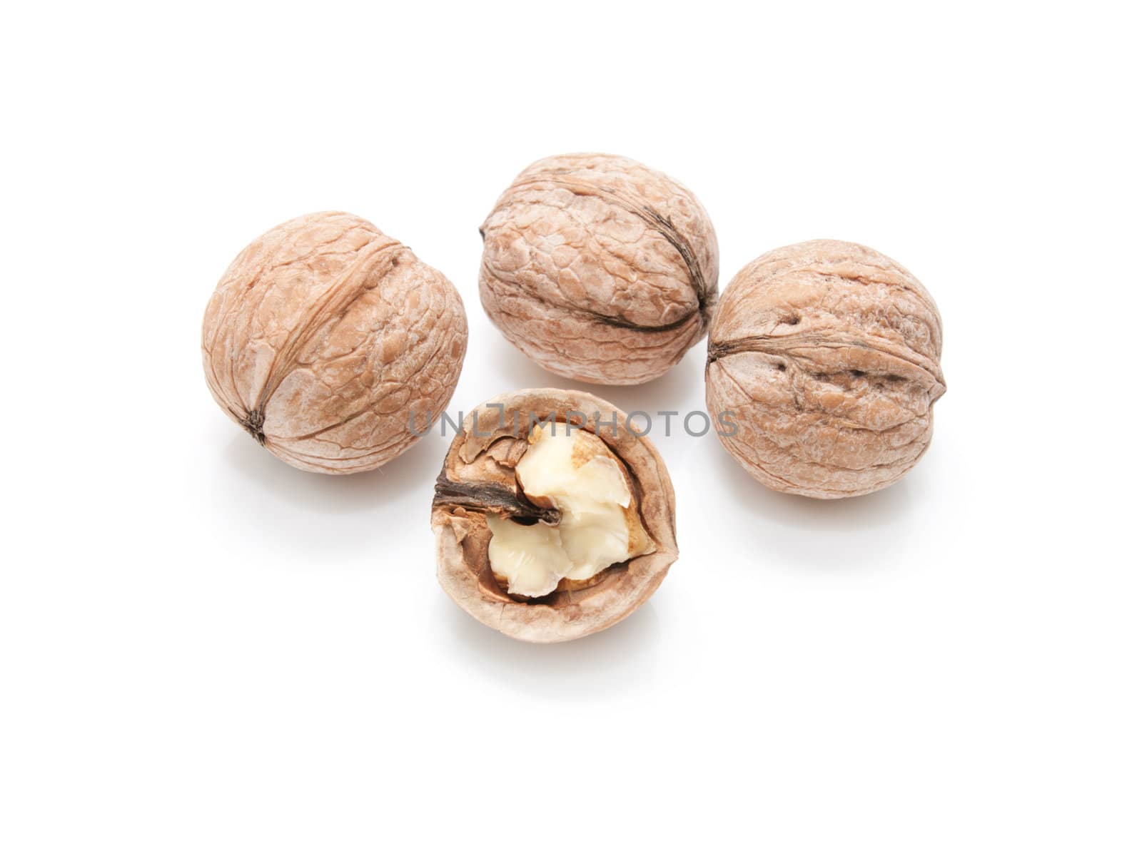 walnut and a cracked walnut isolated on the white background 