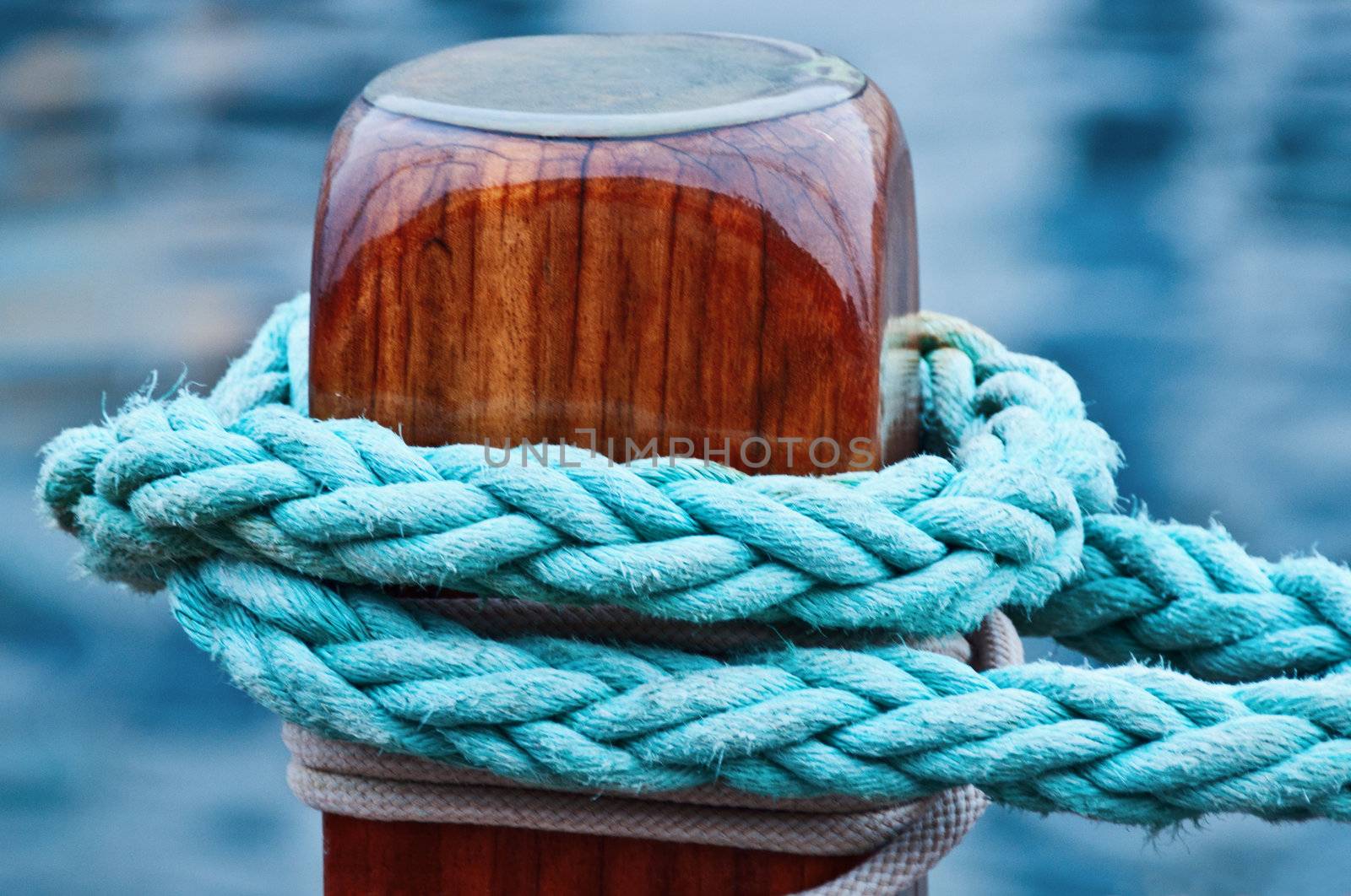 Rope knot on wood of ship close up