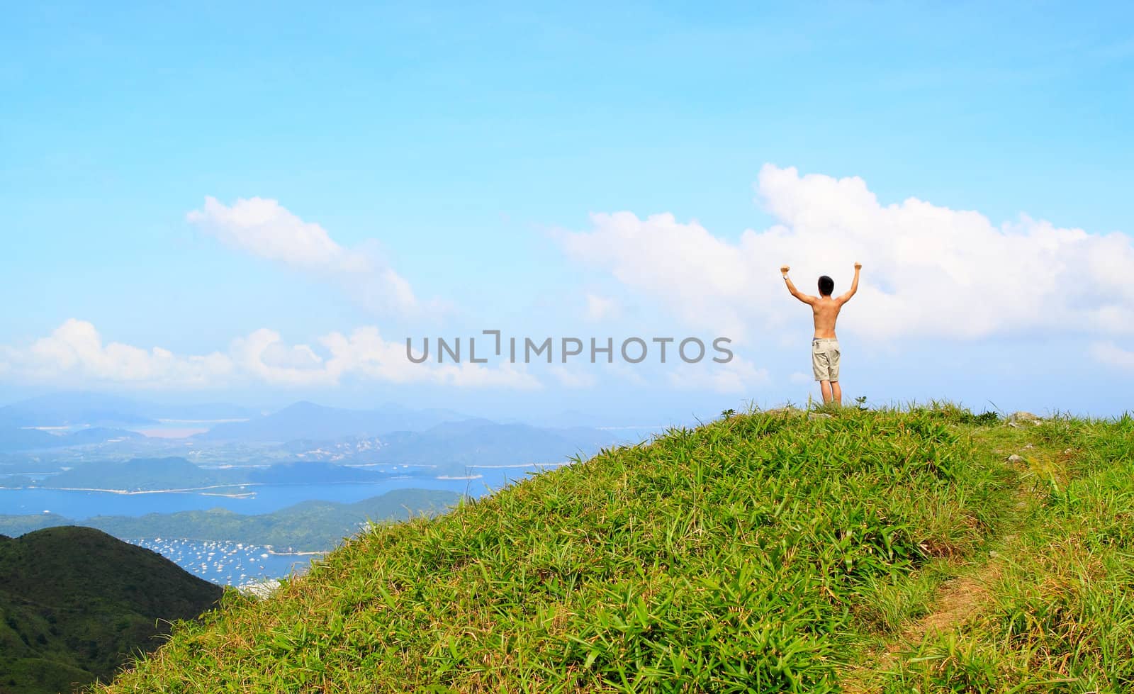 Beautiful mountains landscape with lake in hongkong and man on the top 