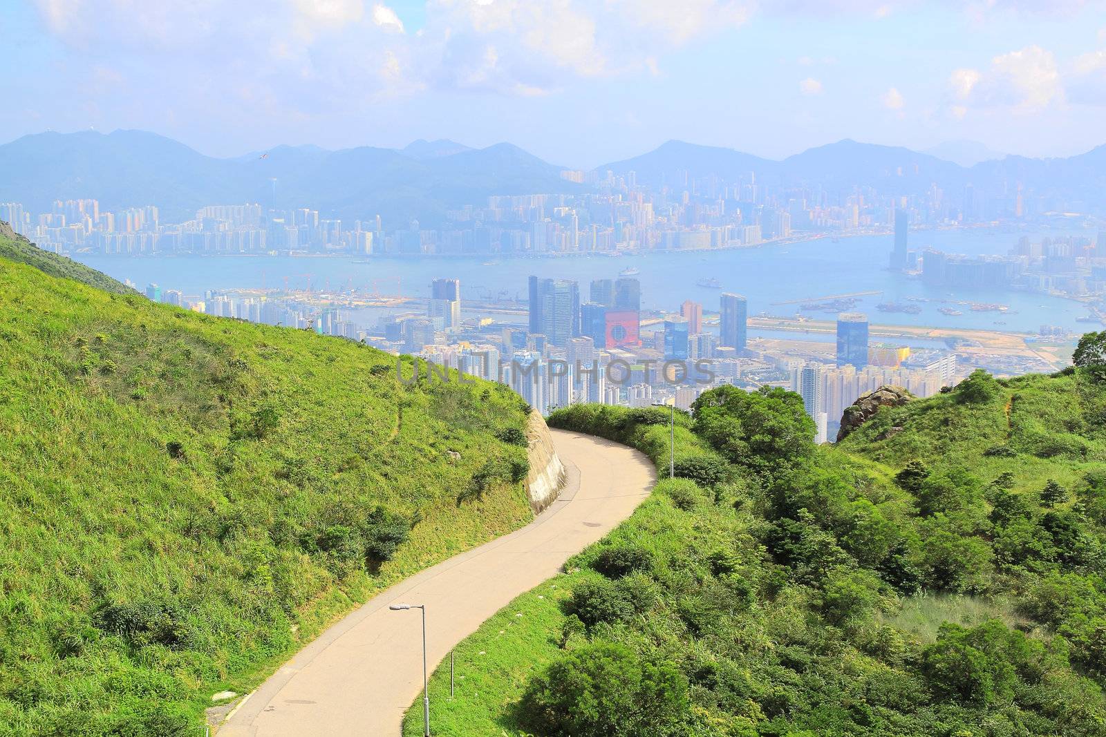 Asphalt winding curve road to city