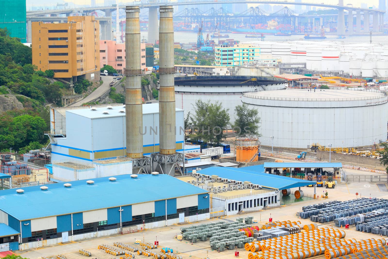 power station , gas tank and cable roll