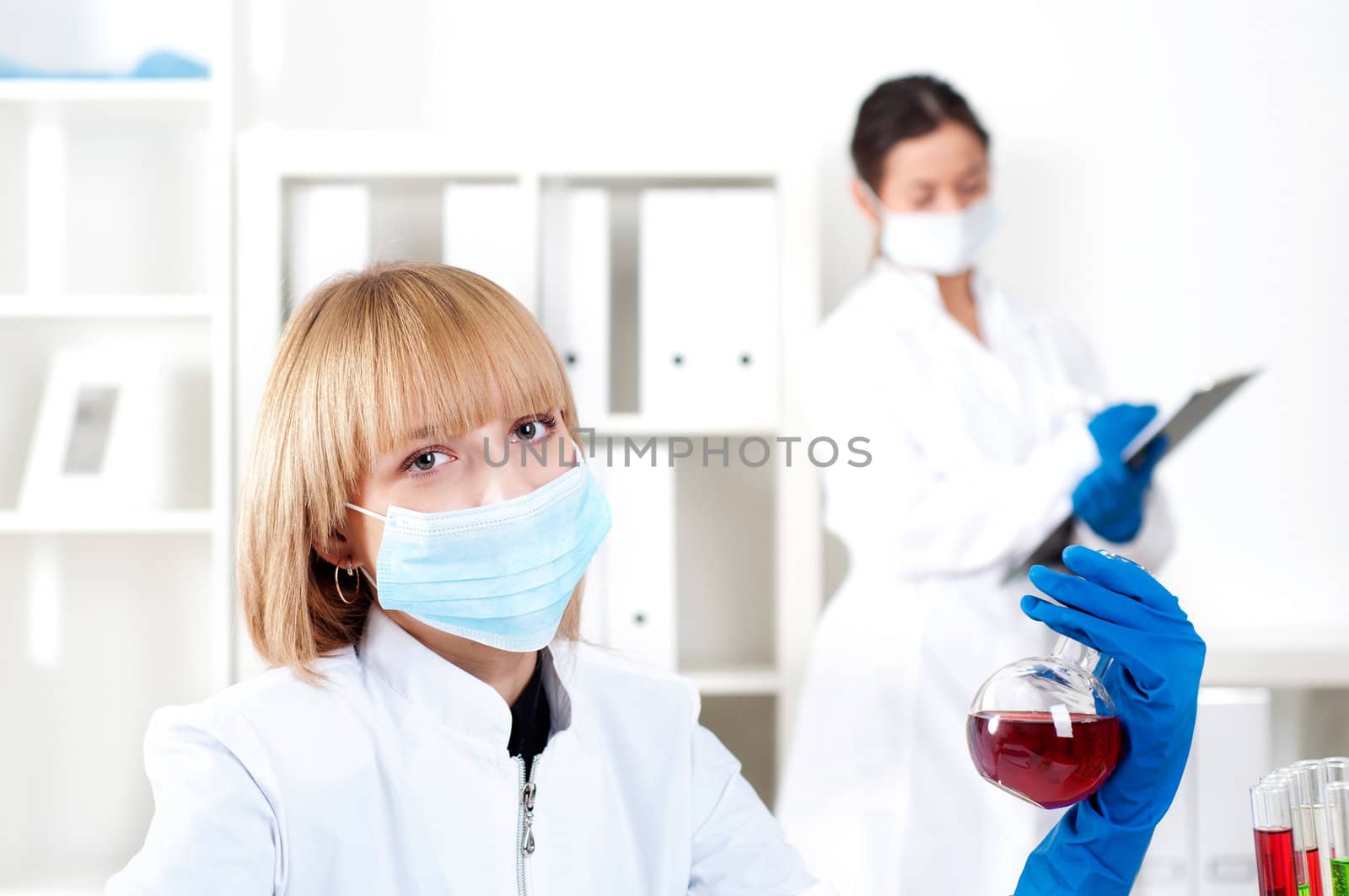 group of scientists working in laboratories with equipment