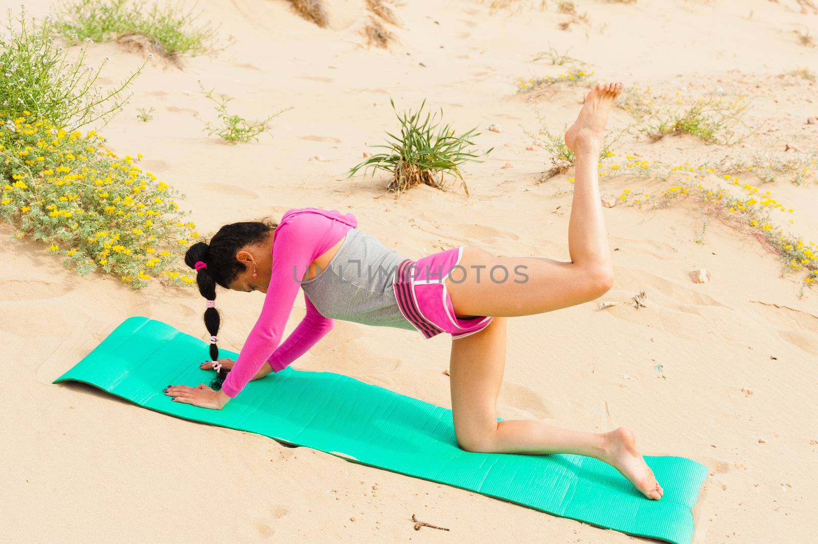 Woman doing fitness exercises outdoors