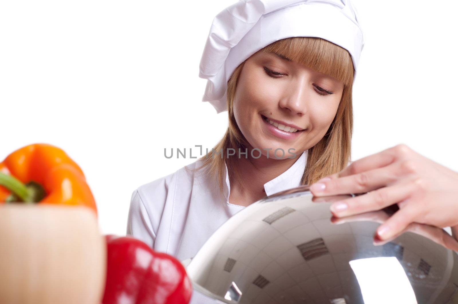 beautiful cook woman hold a metal dish with cooked food