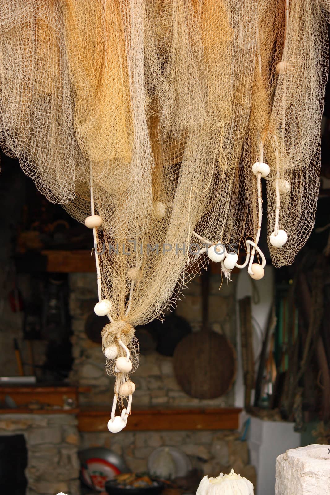 Fishing net hanging in front of the old kitchen