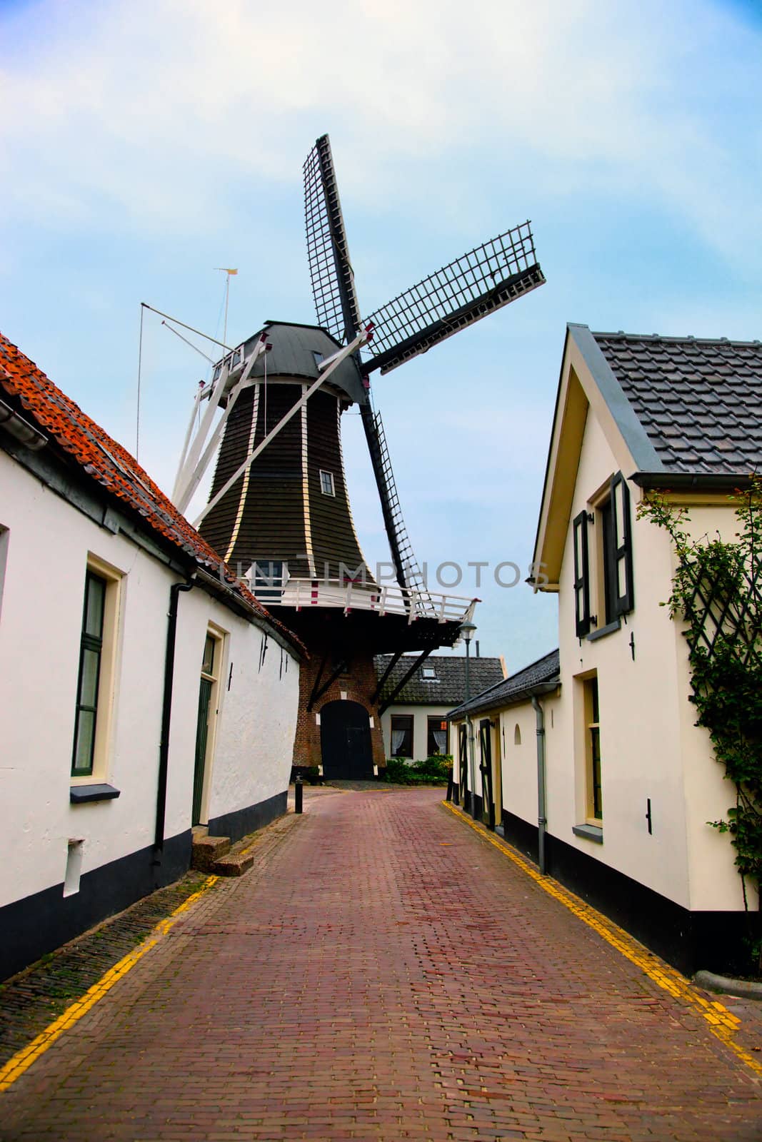 Windmill, historic architecture in small village in Holland, Netherlands