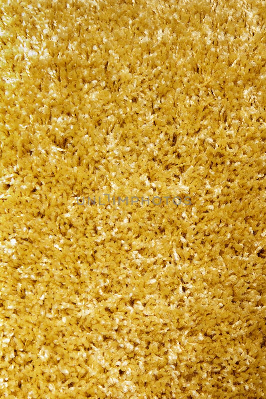 yellow carpet of artificial material close-up. The texture of the carpet