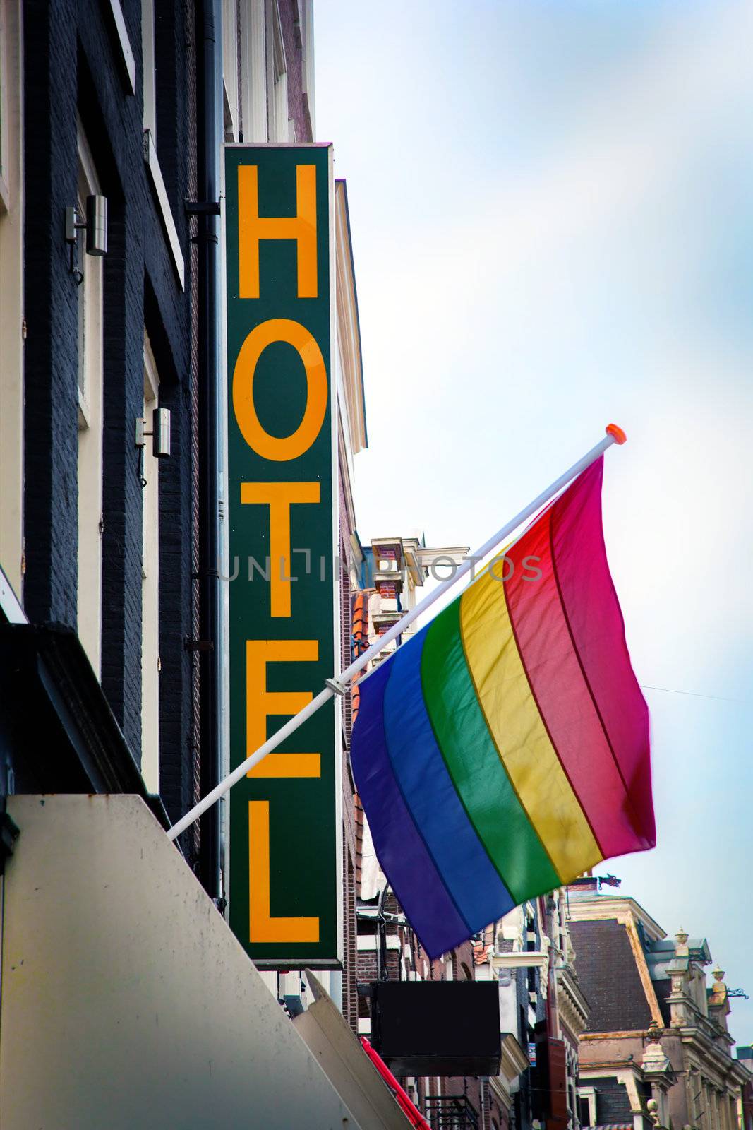 Hotel with The Rainbow Flag - symbol of homosexual, bisexual, and transgender. Amsterdam, Netherlands