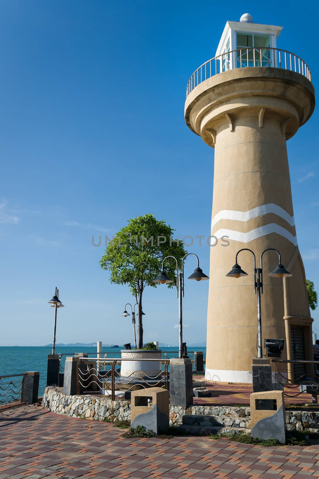 Public Lighthouse On bright sunny sky day