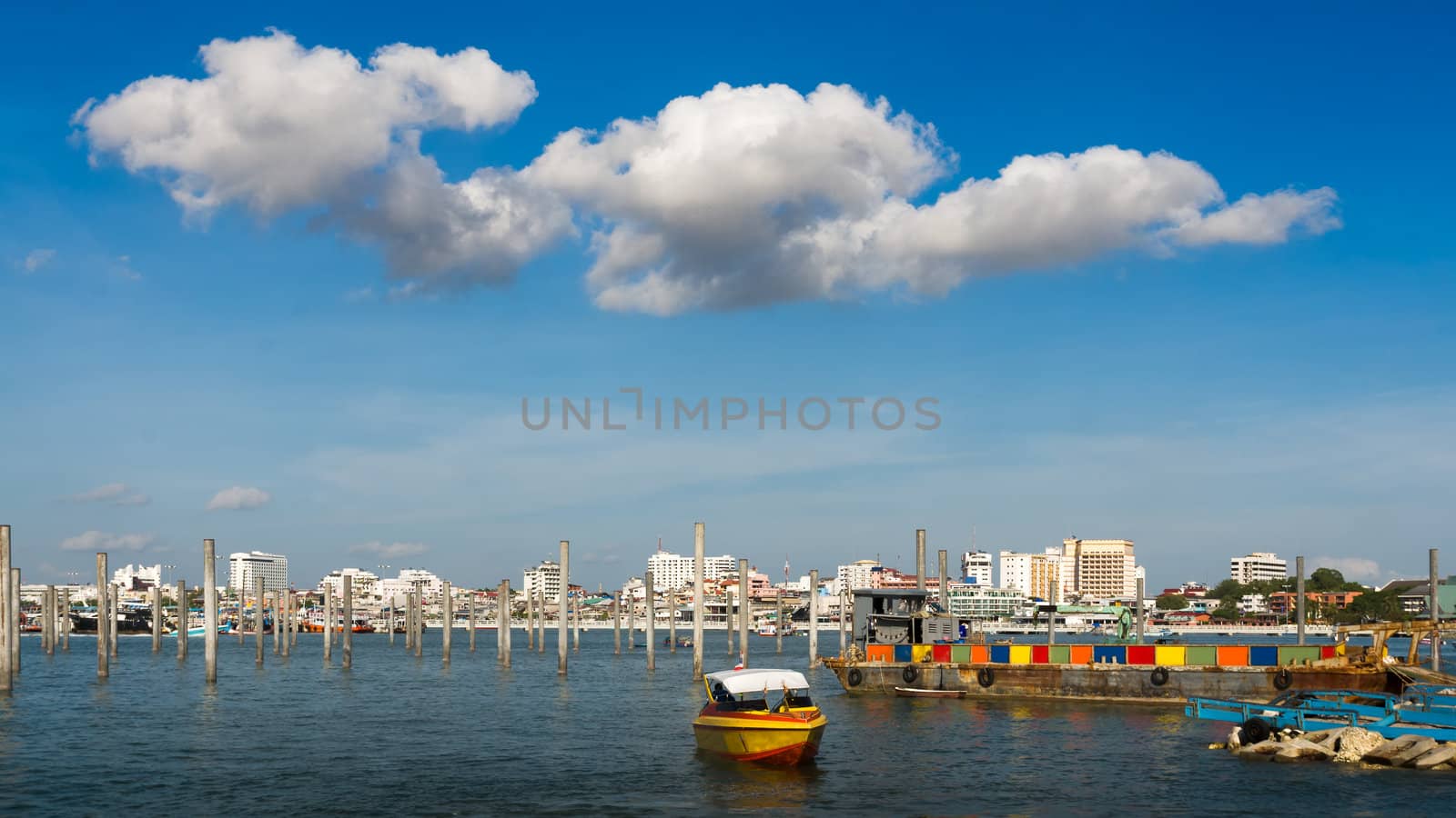 Column in the sea Blue sky and white cloud by nuttakit