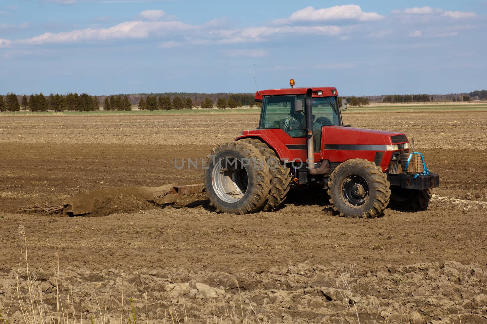 Agriculture.  tractor plowing the fields