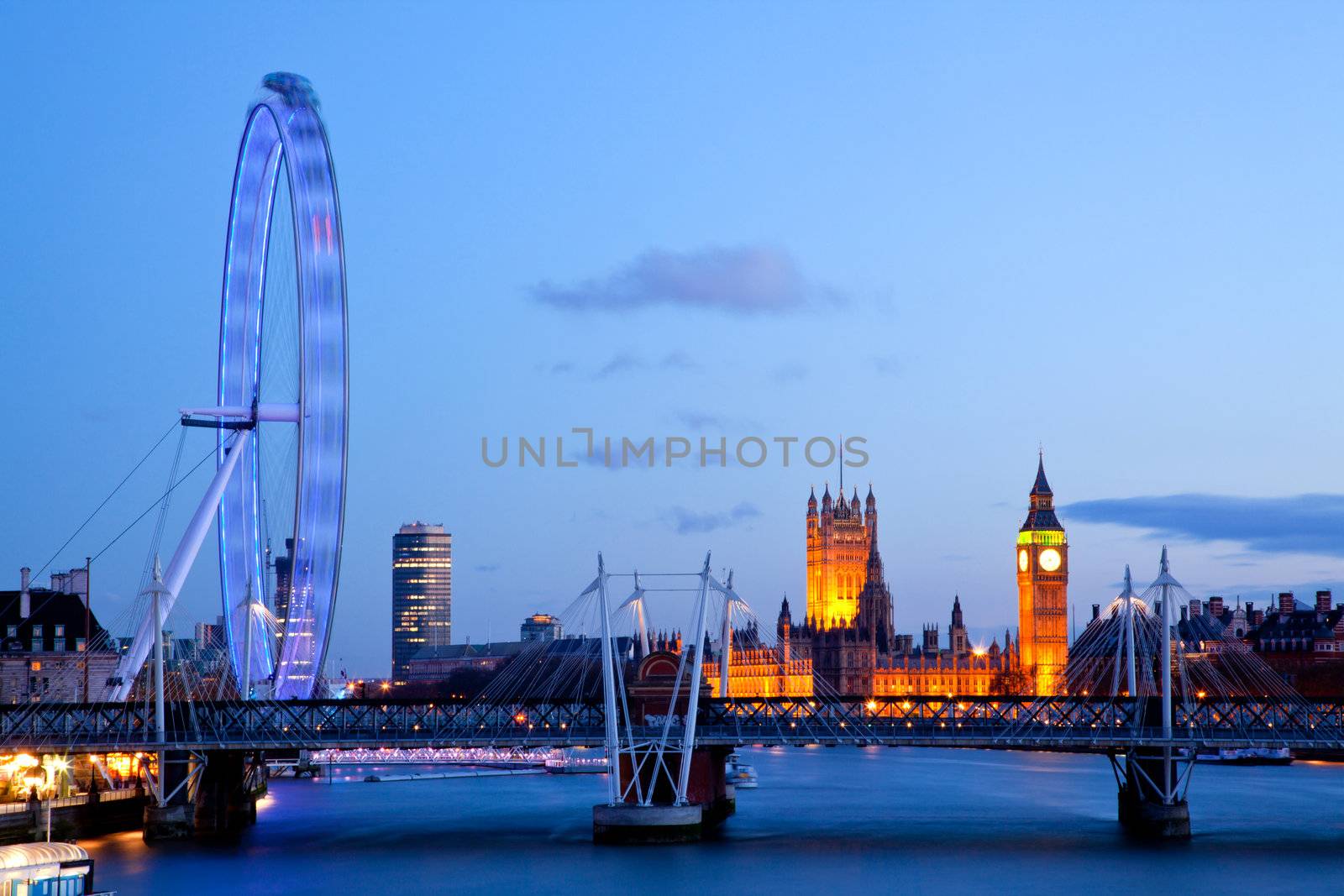 LONDON - April 15: London Eye with Big ben, on April 15, 2012 in London. The largest Ferris wheel in Europe, structure of the London Eye is 135 M. tall and the wheel has a diameter of 120 M.