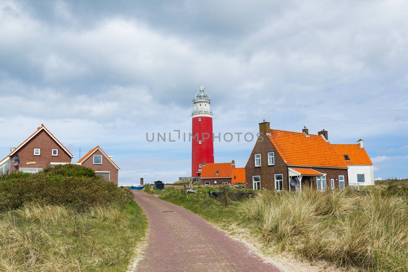 Beautiful red Lighthouse with road, island Texsel, Netherlands