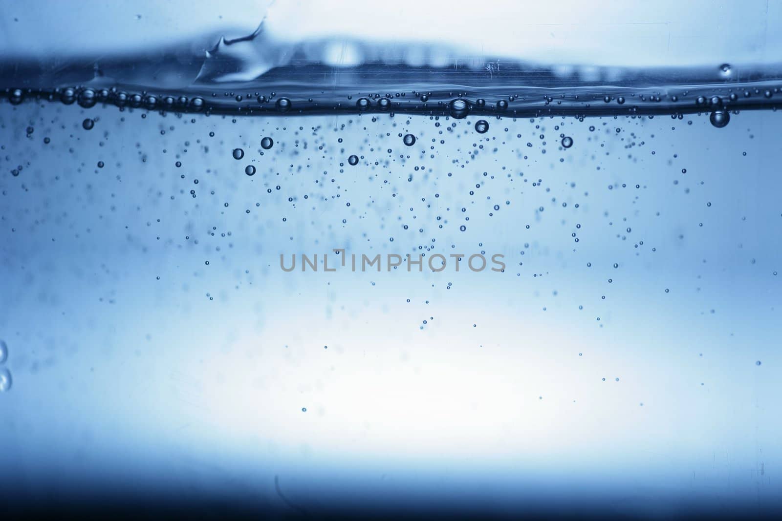 close up of water bubbles in a glass