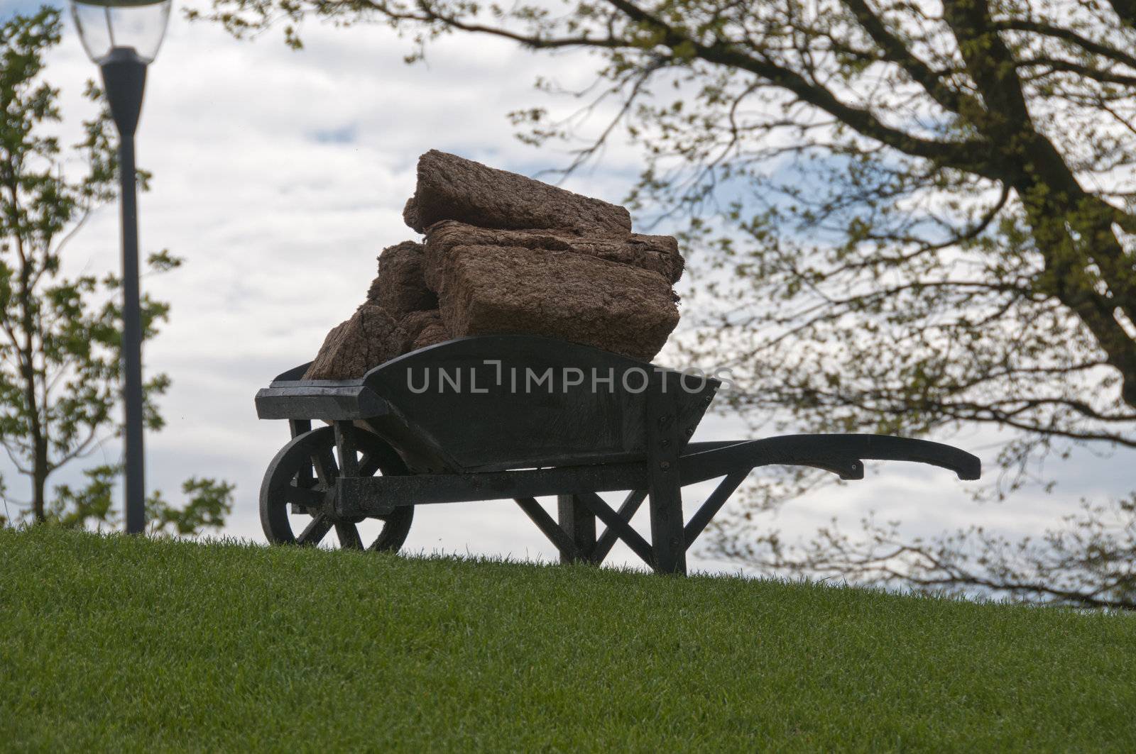 landscape with wheelbarrow with peat