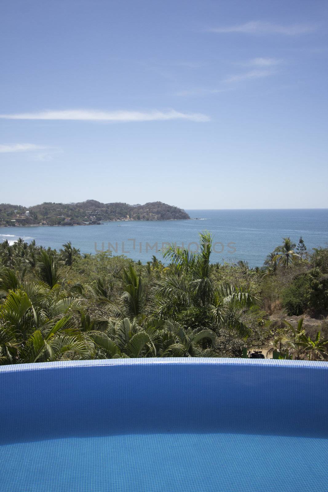 Mexican villa with beach view and a swimming pool.