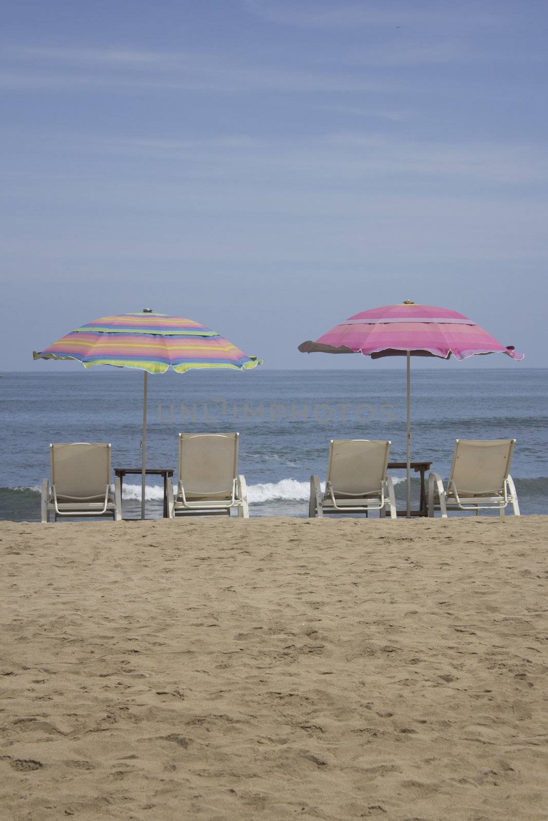 Beach Chairs and Umbrella with Ocean View by jeremywhat