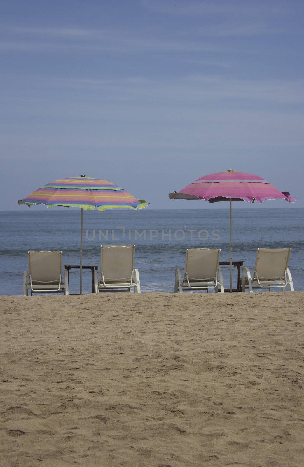 beach with chairs and umbrellas