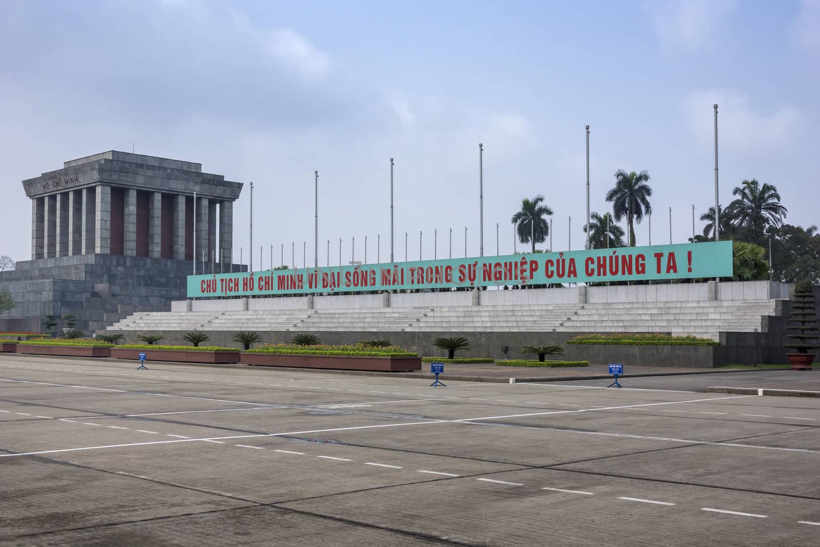 Text says, 'President Ho Chi Minh lives forever in our works!'