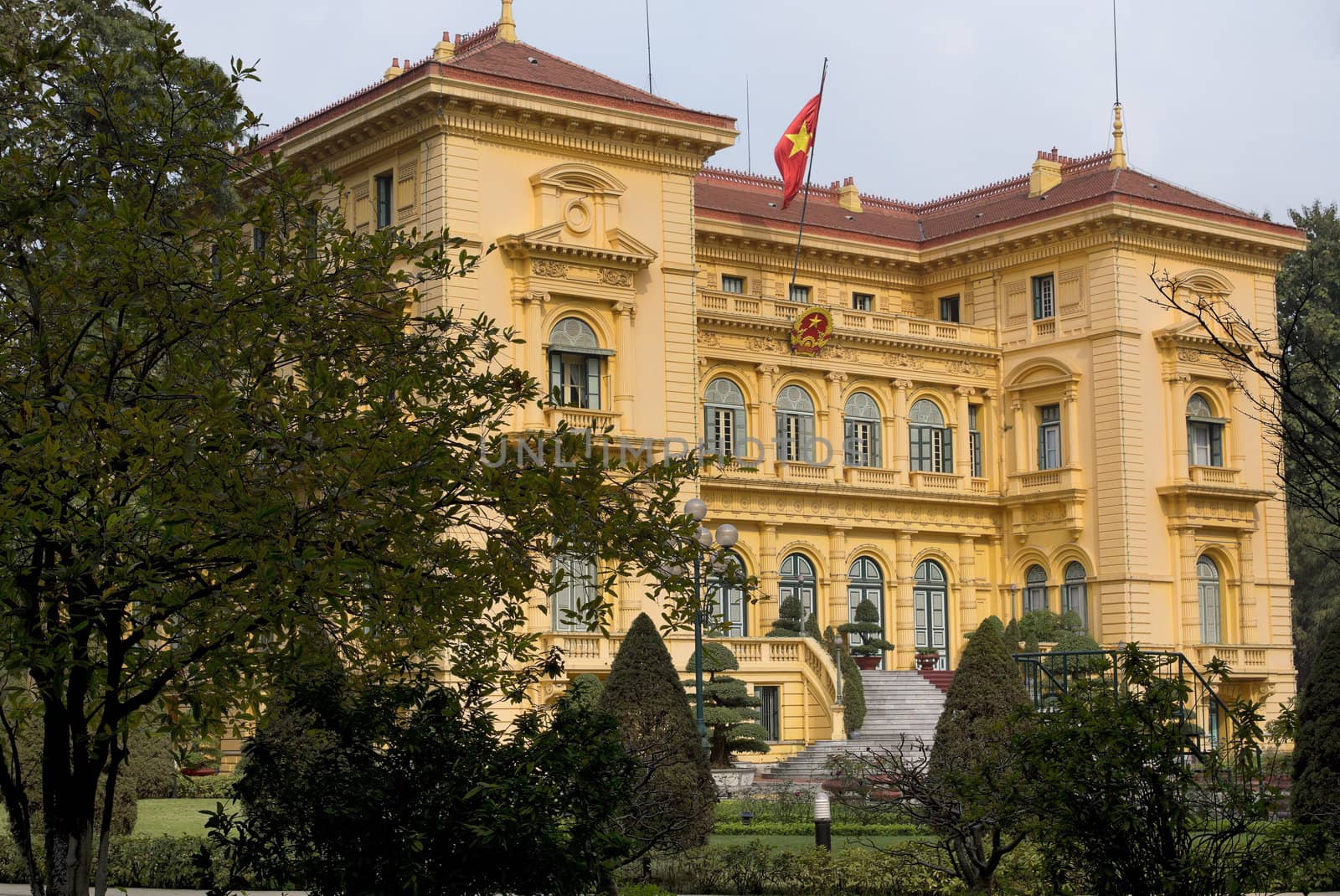 Vietnam Hanoi - March 2012: Presidential Palace in garden and wi by Claudine