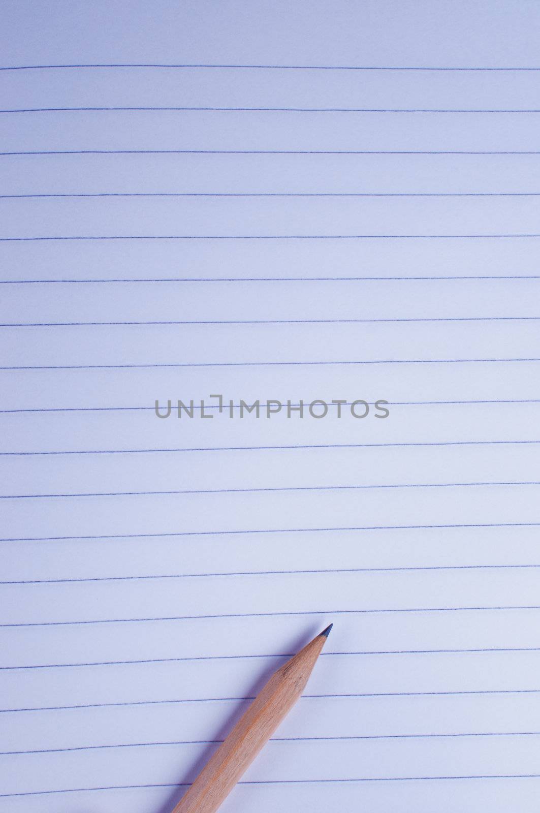 Sheet of paper with a pencil on white background