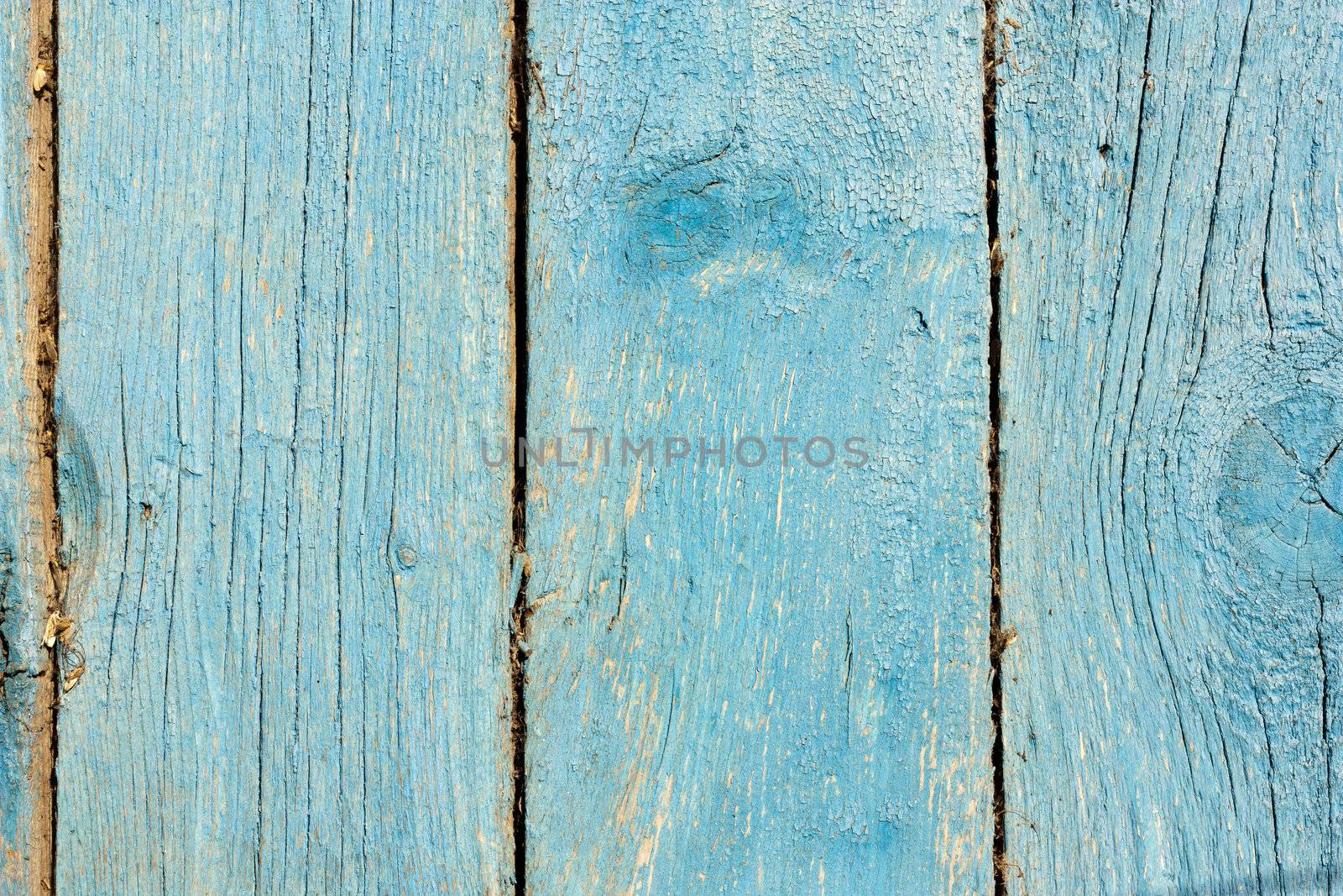 Close up of gray wooden fence panels  by schankz