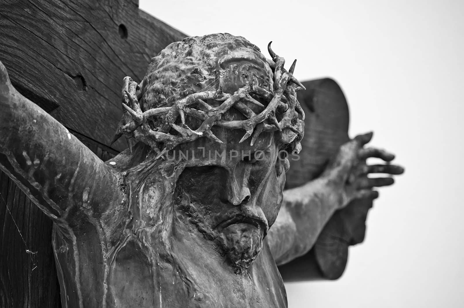 An olden crucifix on the wall of an ancient church.