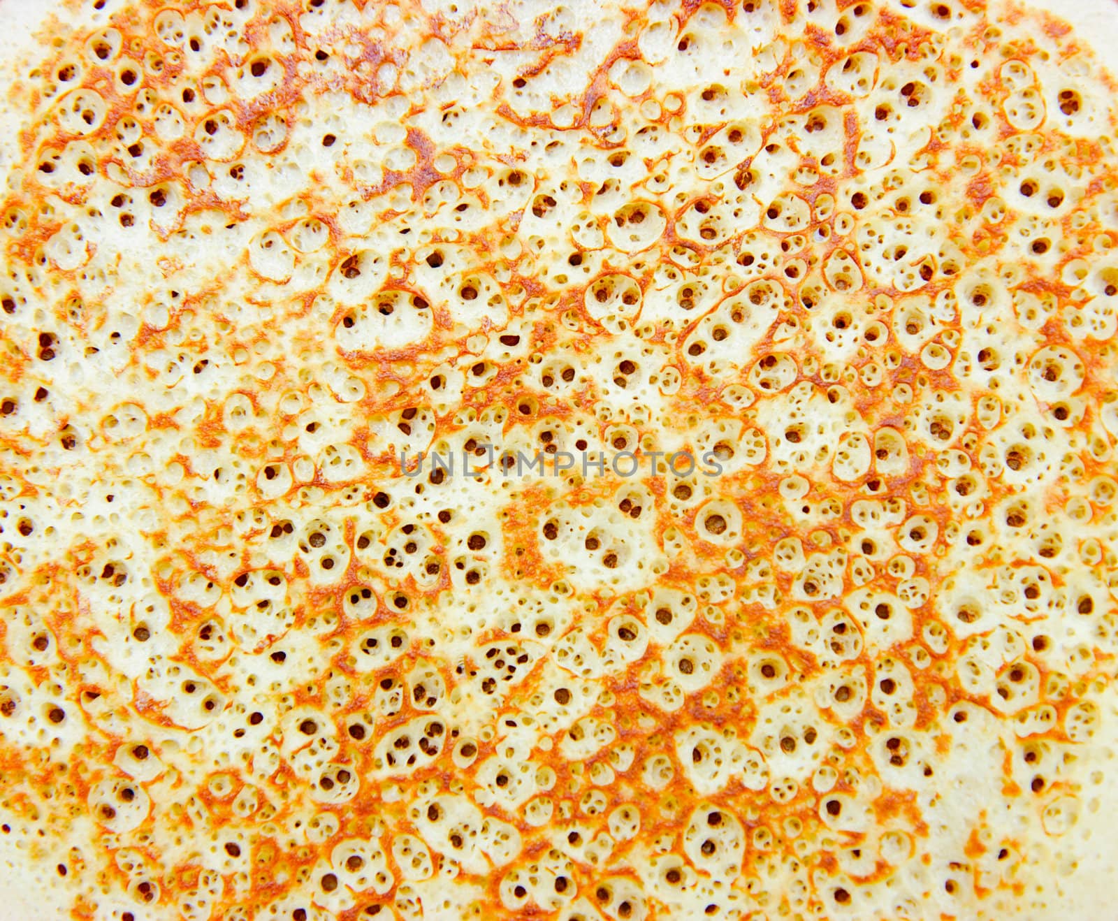 Breakfast. Porous texture of crispy pancake closeup