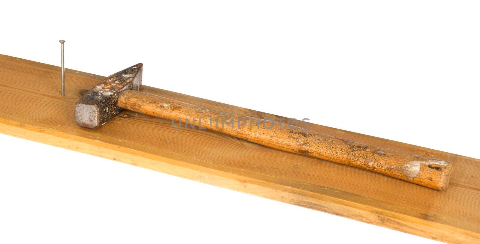 Hammer, nail and wooden board, isolated on background
