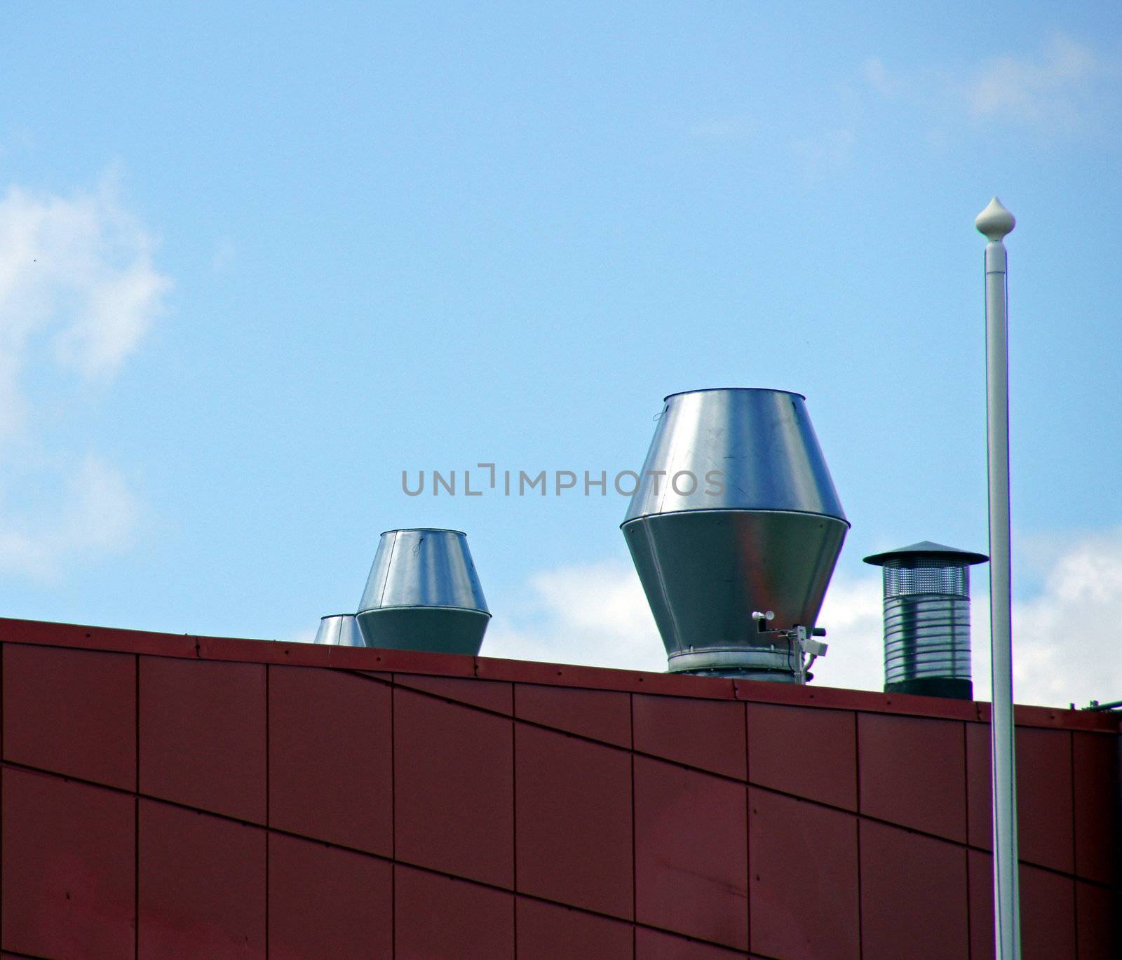  Ventilation on a roof on a background of the blue sky