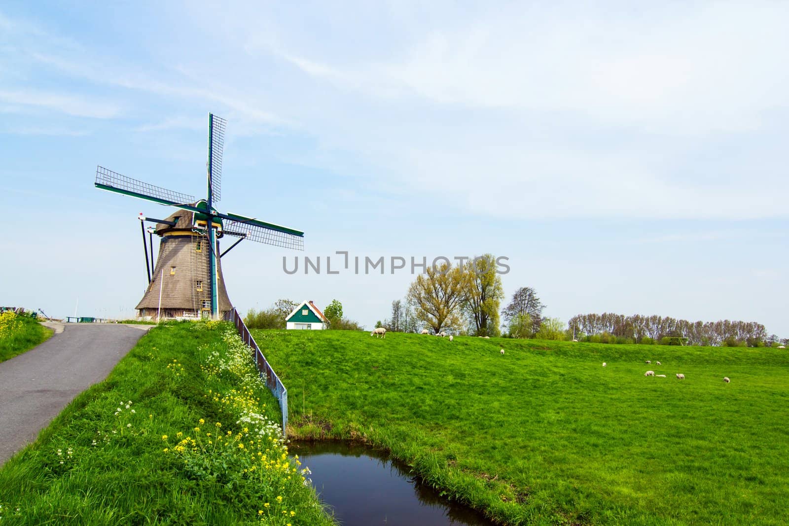A traditional Dutch windmill near the canal. Netherlands