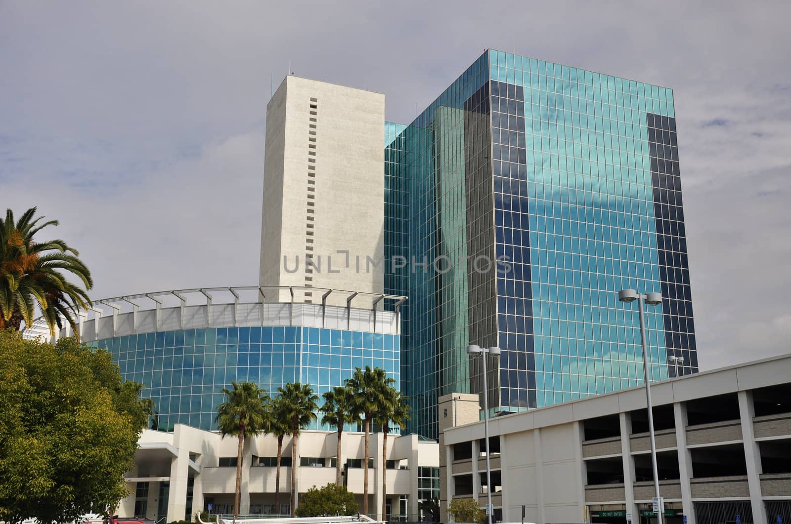 View of a modern glass office tower in downtown Riverside, California.