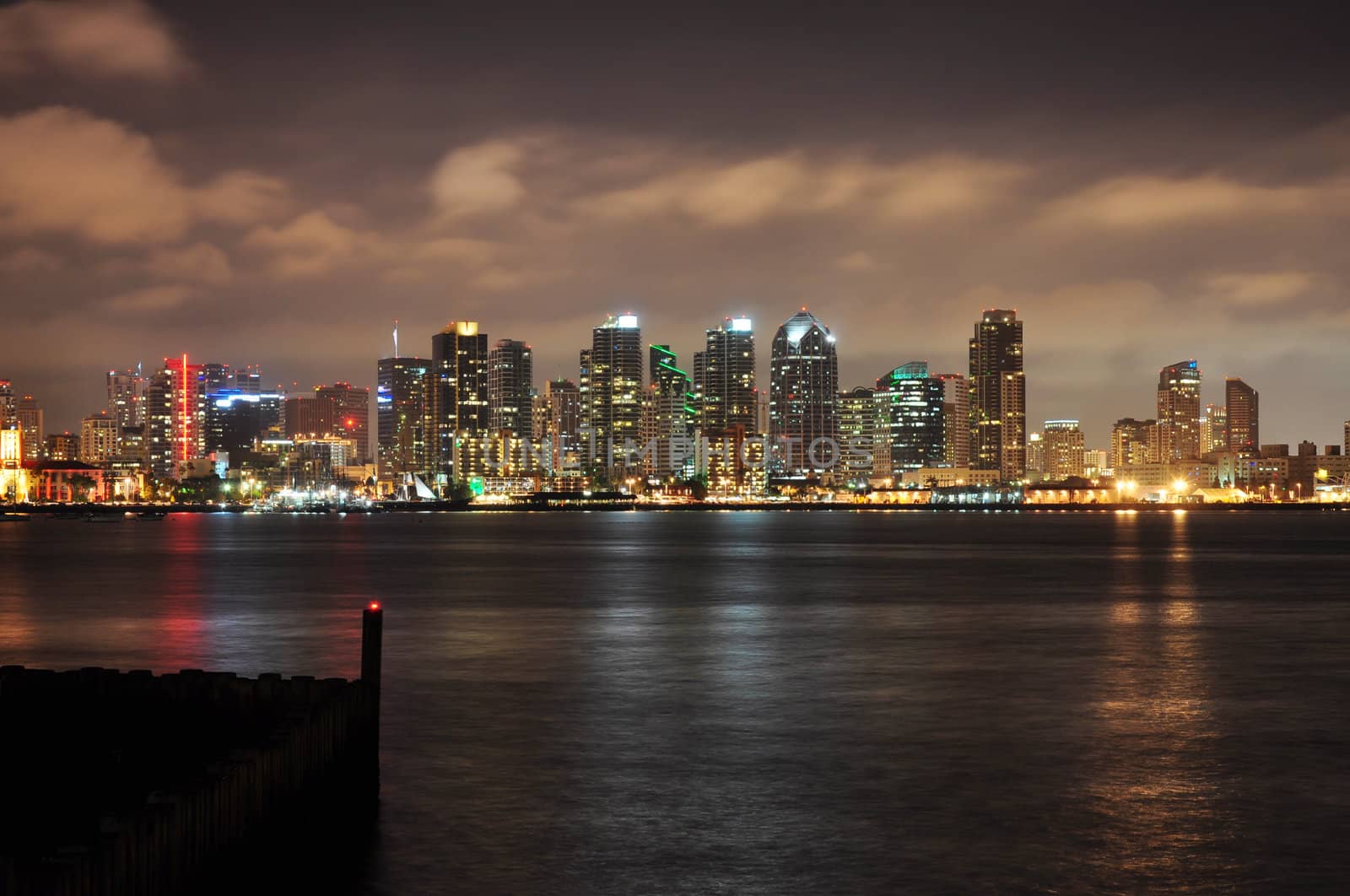The downtown buildings light up as evening falls in San Diego, California.