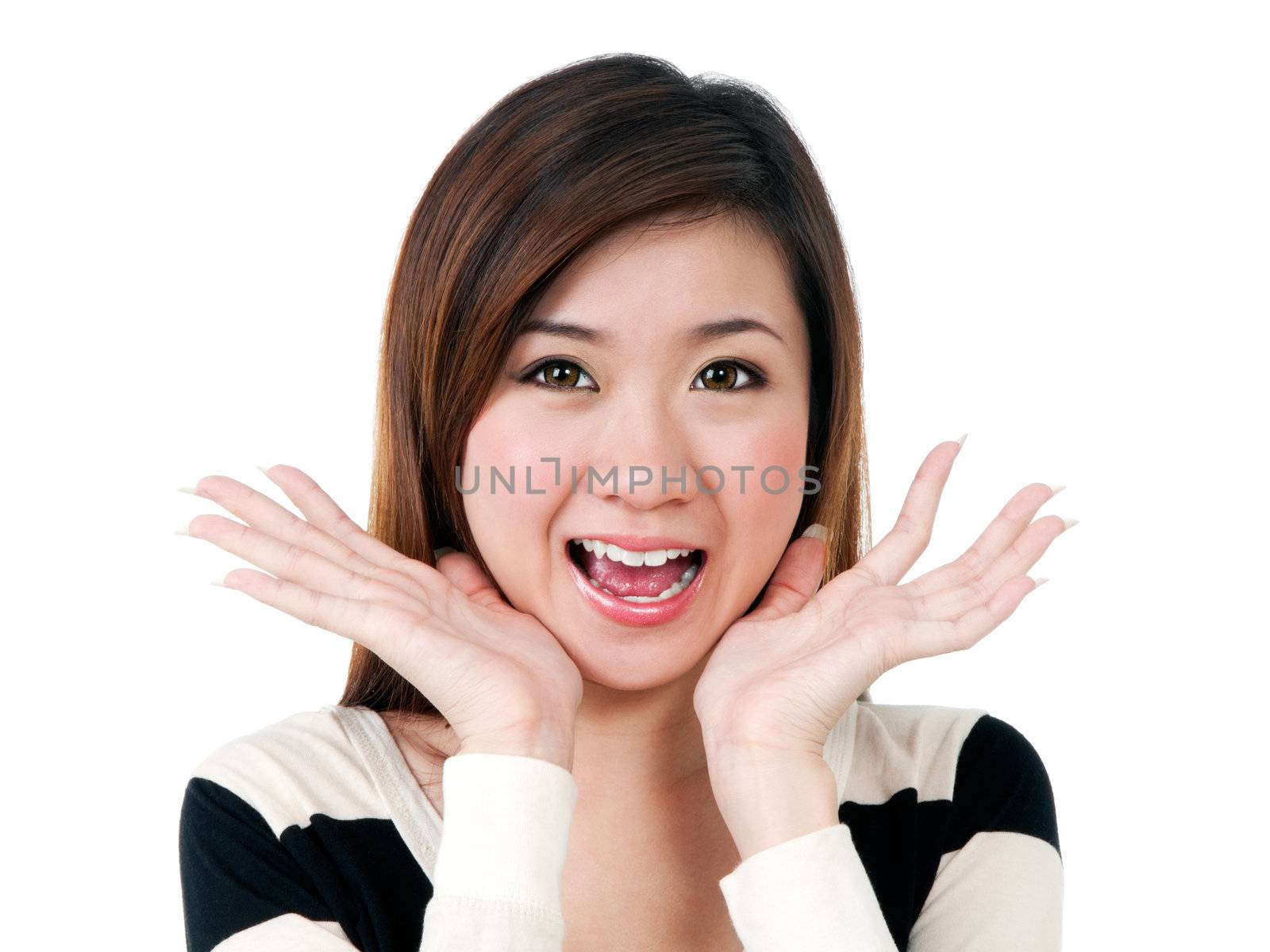 Portrait of a cute young Asian woman looking surprised over white background.