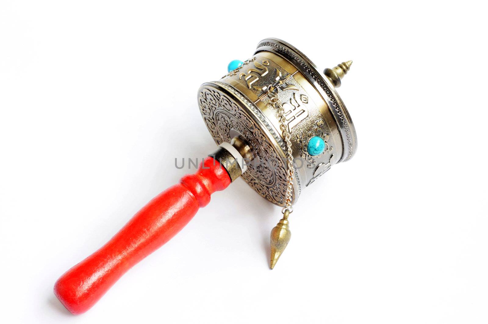 Tibetan prayer wheel on a white background