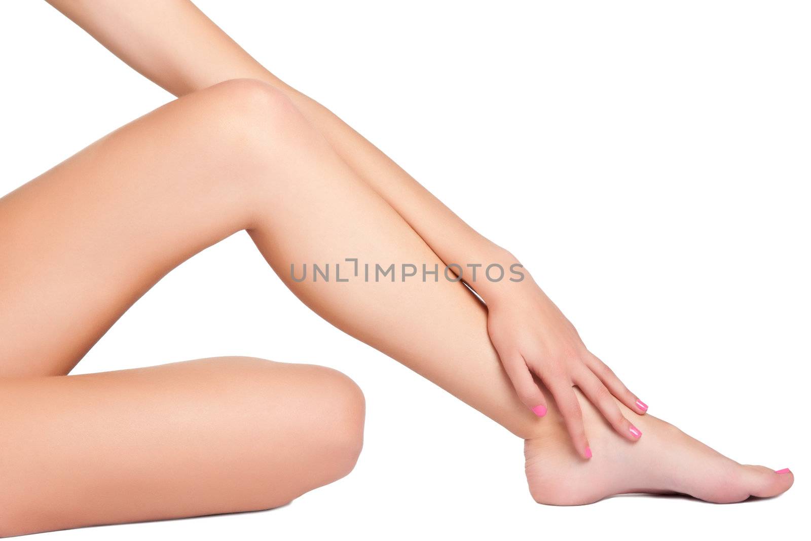 Woman's legs isolated on a white background
