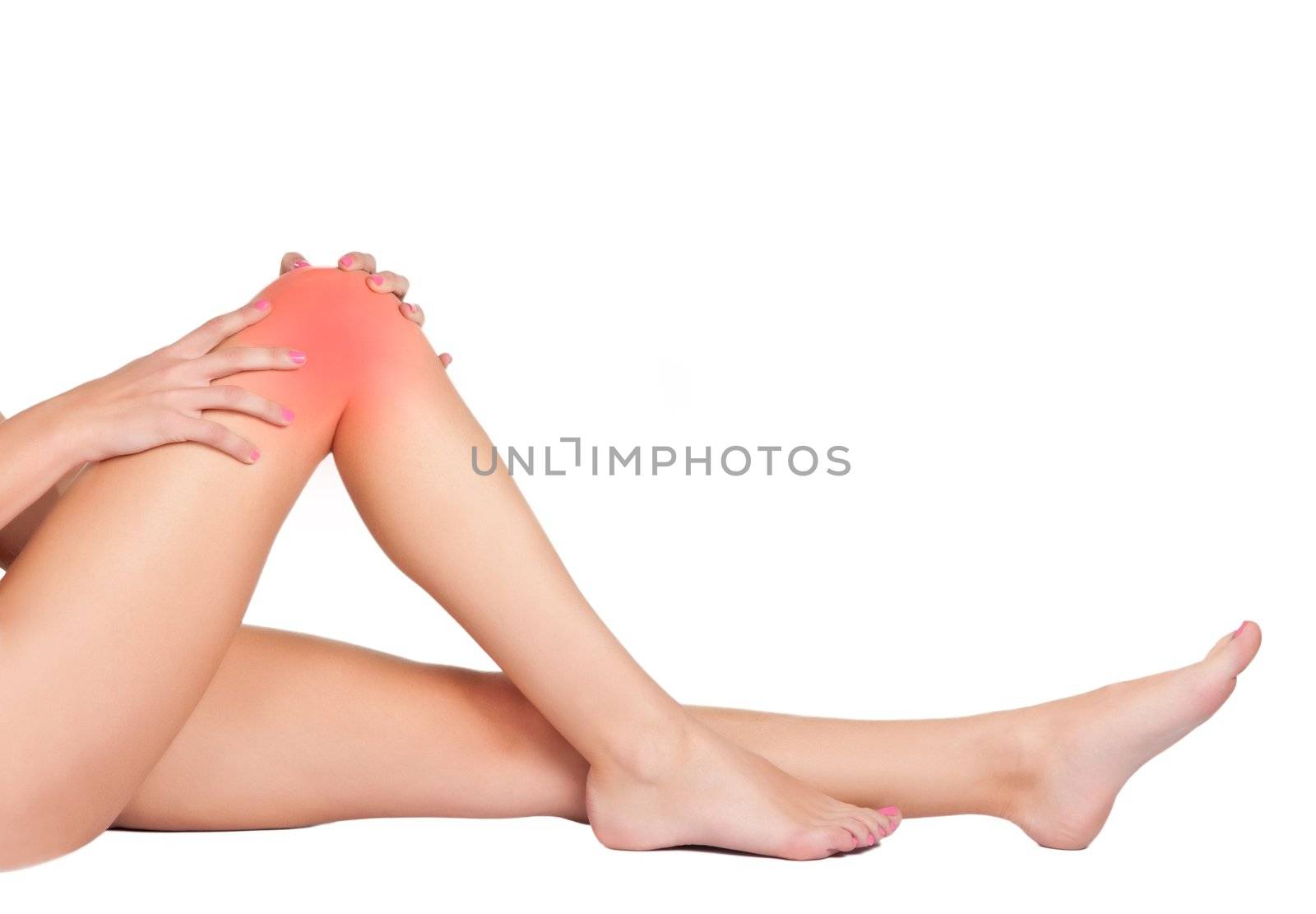 Woman's legs with a red painful spot isolated on a white background