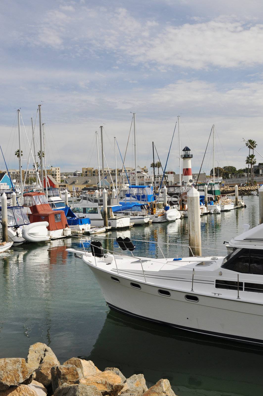 Boats and yachts are anchored at a small harbor in Oceanside, California.