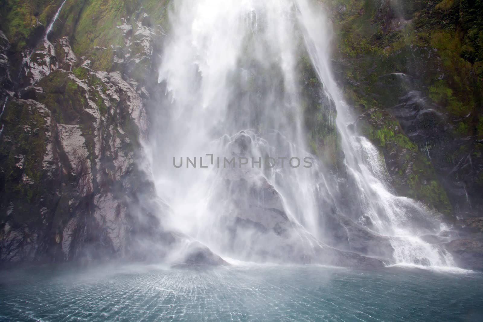 Splashing of milford sound waterfall New Zealand