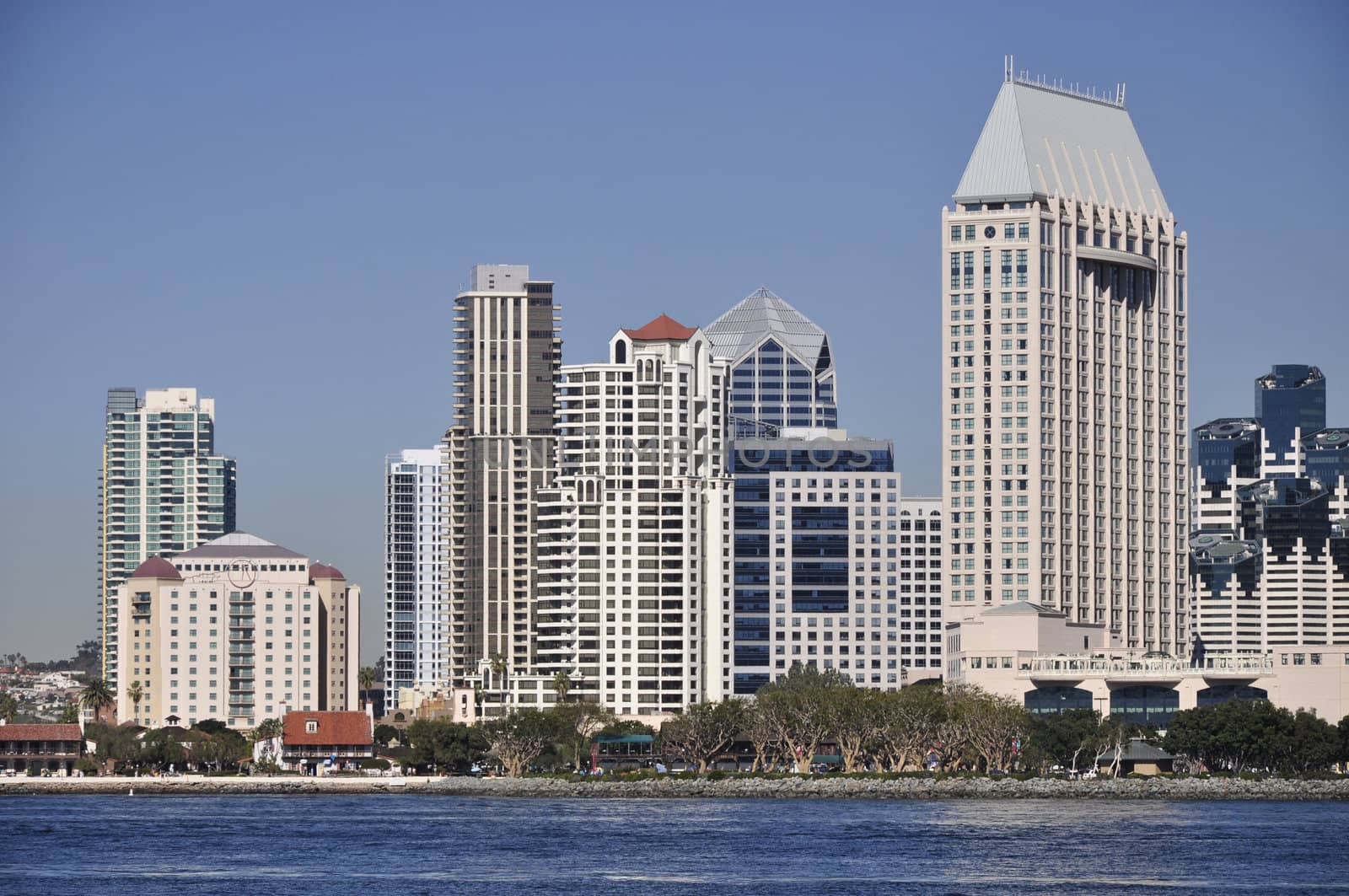Tall office and hotel towers line the waterfront in San Diego, California.