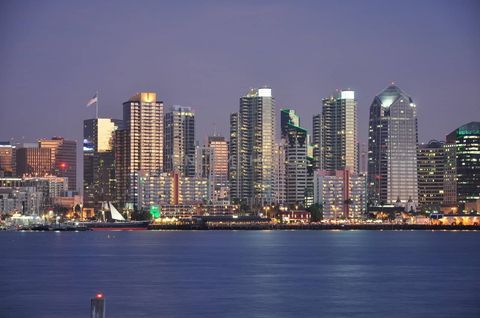 The downtown San Diego, California skyline is seen from Harbor Island at dusk.
